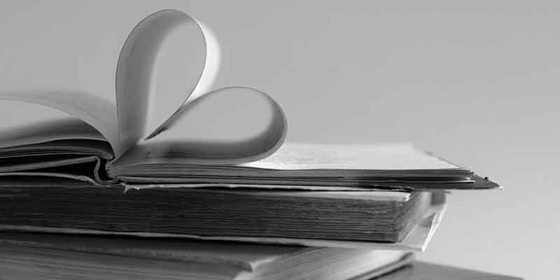 Old hard cover book page decorate to heart shape for love in val